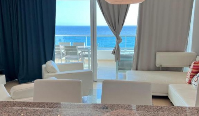 Beachfront condo with pool, direct access to beach and indoor restaurant